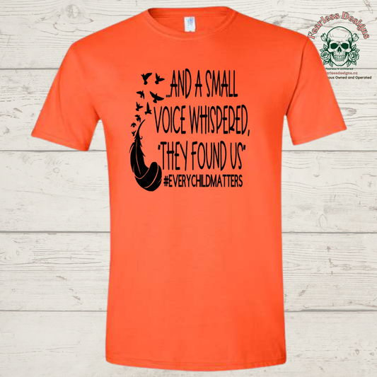 And a small voice whispered they found us - orange unisex tshirt